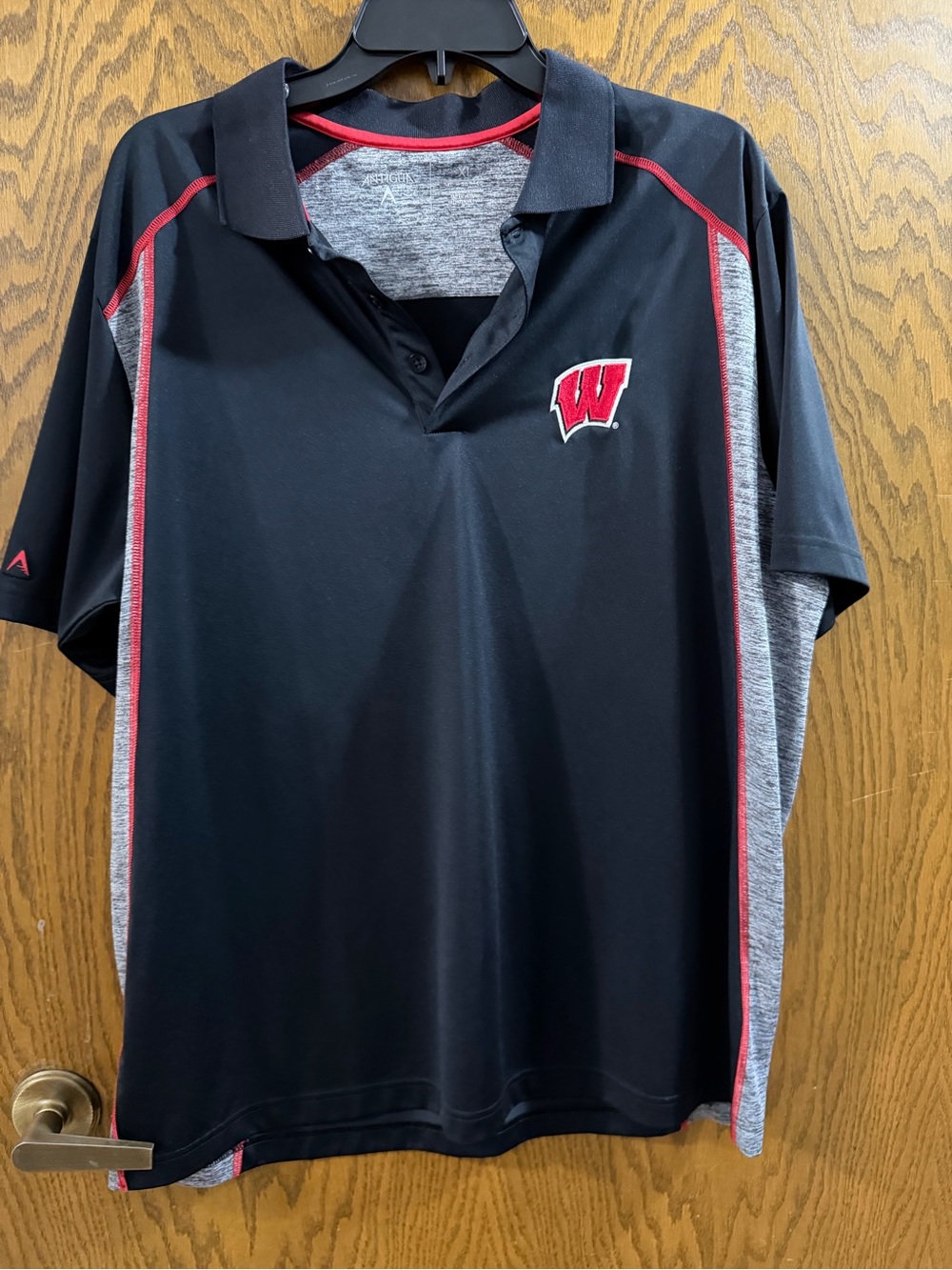 Antigua Black Performance Polo with Red & Gray Accents - Wisconsin W Logo